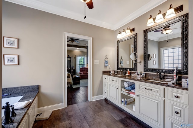 bathroom featuring vanity, ornamental molding, and hardwood / wood-style flooring