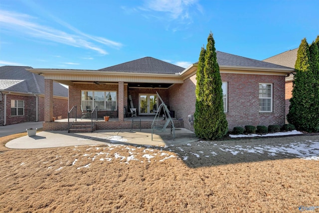 back of house with ceiling fan and a patio area