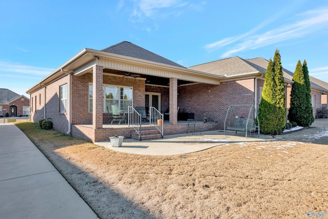 back of property with a patio and ceiling fan