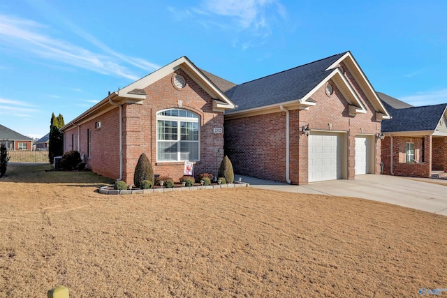 view of front of house with a front yard and a garage