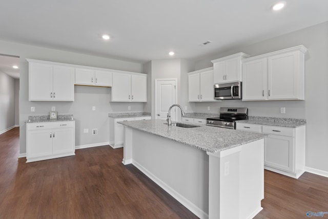 148 Aurora Cir, Fayetteville, TN 37334 - kitchen with appliances with stainless steel finishes, a sink, an island with sink, white cabinets, and dark wood finished floors