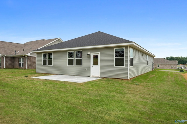 148 Aurora Cir, Fayetteville, TN 37334 - rear view of property with a patio, a lawn, and a shingled roof