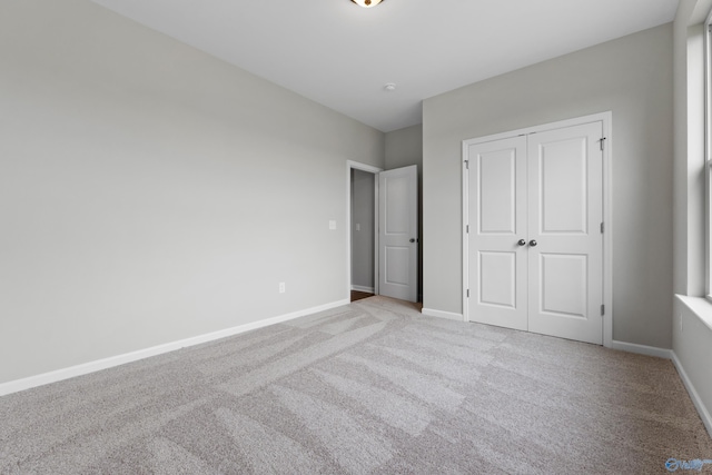 148 Aurora Cir, Fayetteville, TN 37334 - unfurnished bedroom featuring carpet flooring, a closet, and baseboards