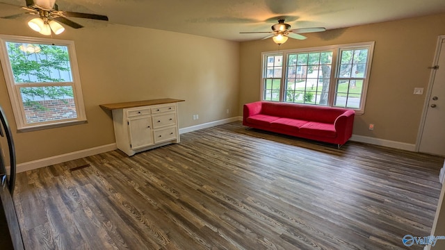 3703 Fox Trail Cir, Huntsville, AL 35810 - sitting room featuring ceiling fan, dark wood-style flooring, and baseboards