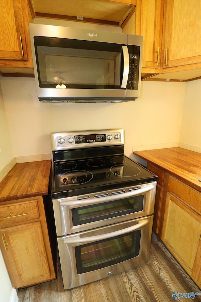3703 Fox Trail Cir, Huntsville, AL 35810 - kitchen featuring stainless steel appliances, butcher block counters, and wood finished floors