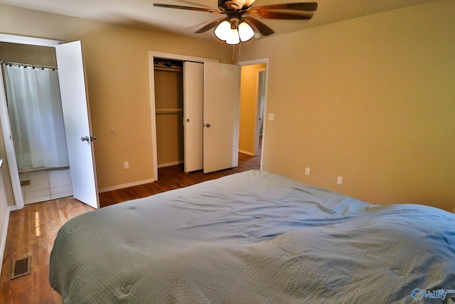 3703 Fox Trail Cir, Huntsville, AL 35810 - bedroom with wood finished floors, baseboards, and a ceiling fan
