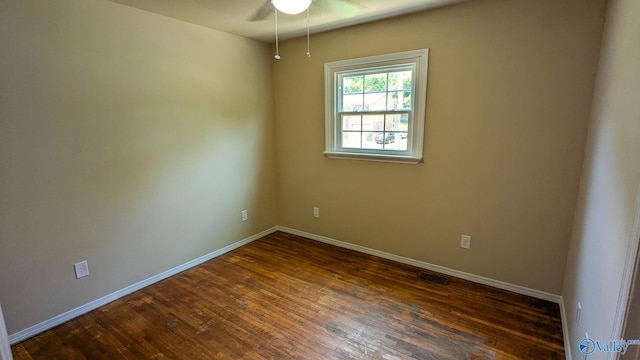 3703 Fox Trail Cir, Huntsville, AL 35810 - unfurnished room with dark wood-style floors, baseboards, and ceiling fan