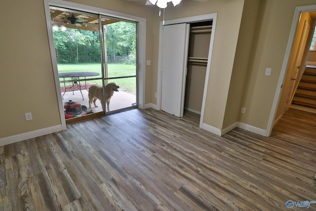 3703 Fox Trail Cir, Huntsville, AL 35810 - unfurnished bedroom with baseboards, wood finished floors, a closet, and access to outside