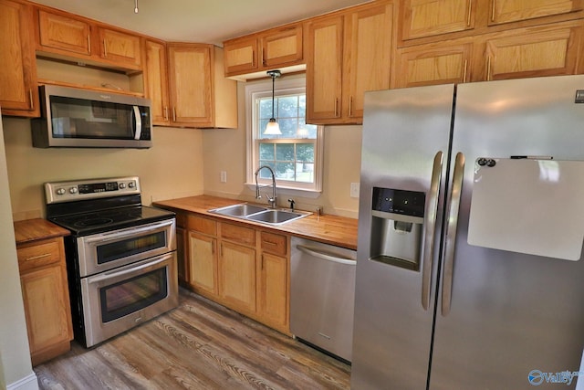 3703 Fox Trail Cir, Huntsville, AL 35810 - kitchen featuring appliances with stainless steel finishes, a sink, wood finished floors, and wood counters