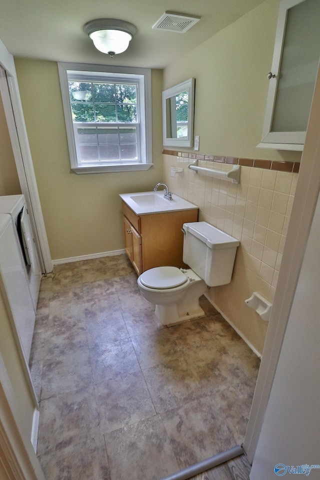 3703 Fox Trail Cir, Huntsville, AL 35810 - bathroom with toilet, vanity, and tile walls