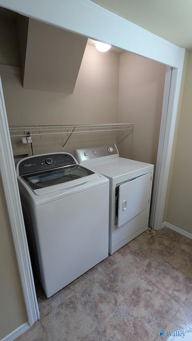 3703 Fox Trail Cir, Huntsville, AL 35810 - washroom with washing machine and dryer and baseboards