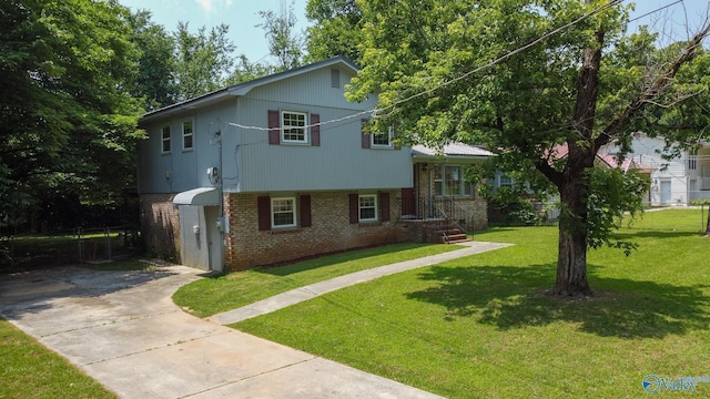 3703 Fox Trail Cir, Huntsville, AL 35810 - tri-level home featuring brick siding, concrete driveway, and a front yard