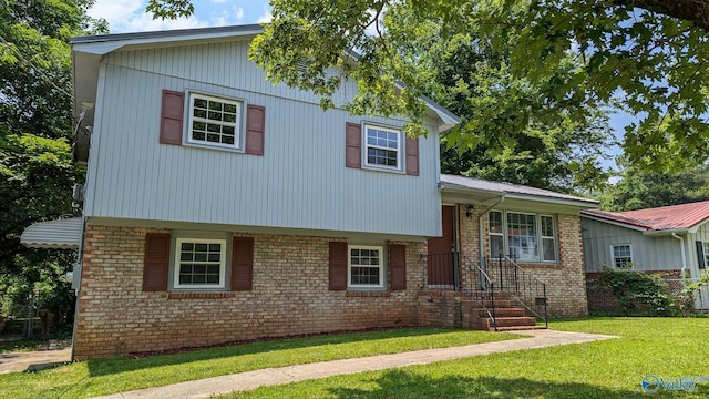 3703 Fox Trail Cir, Huntsville, AL 35810 - tri-level home with a front yard, brick siding, and metal roof