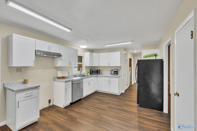 kitchen featuring appliances with stainless steel finishes, dark hardwood / wood-style floors, white cabinetry, and sink