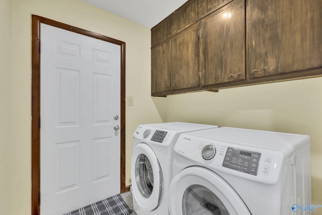 washroom with cabinets and independent washer and dryer