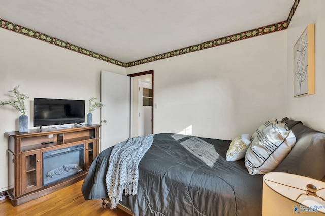 bedroom featuring hardwood / wood-style floors