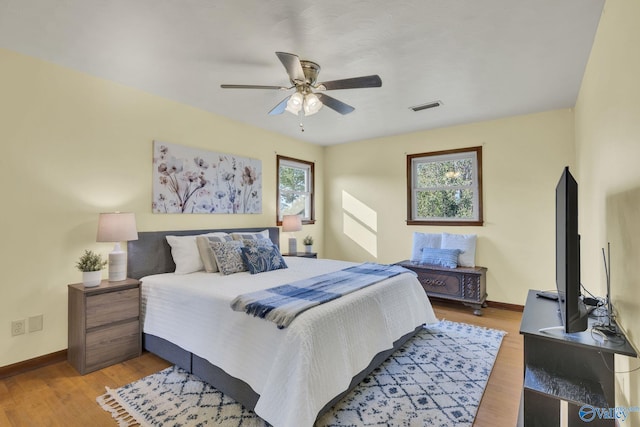 bedroom featuring wood-type flooring and ceiling fan