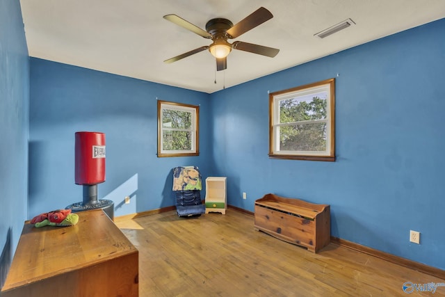 office space with ceiling fan and light wood-type flooring