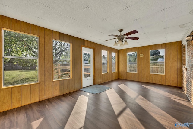 unfurnished sunroom featuring plenty of natural light and ceiling fan