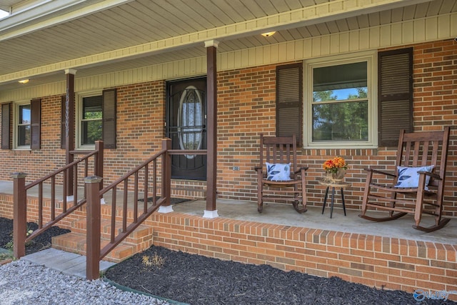 doorway to property featuring a porch