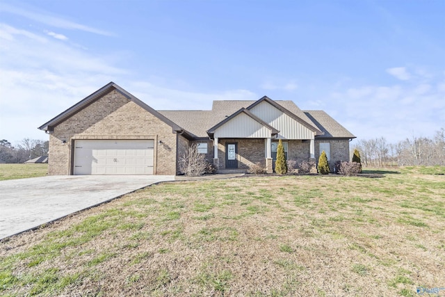 view of front of property featuring a front yard, an attached garage, brick siding, and driveway