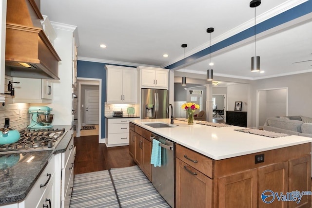 7528 Flint Crossing Cir, Owens Cross Roads, AL 35763 - kitchen with appliances with stainless steel finishes, dark wood-style flooring, open floor plan, brown cabinetry, and tasteful backsplash