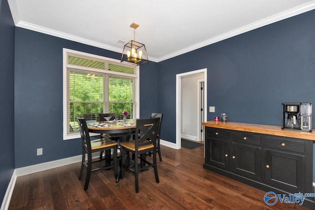 7528 Flint Crossing Cir, Owens Cross Roads, AL 35763 - dining area with dark wood-type flooring, ornamental molding, and a chandelier