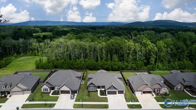 7528 Flint Crossing Cir, Owens Cross Roads, AL 35763 - aerial perspective of suburban area featuring a forest and mountains