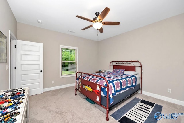7528 Flint Crossing Cir, Owens Cross Roads, AL 35763 - bedroom featuring light carpet and ceiling fan