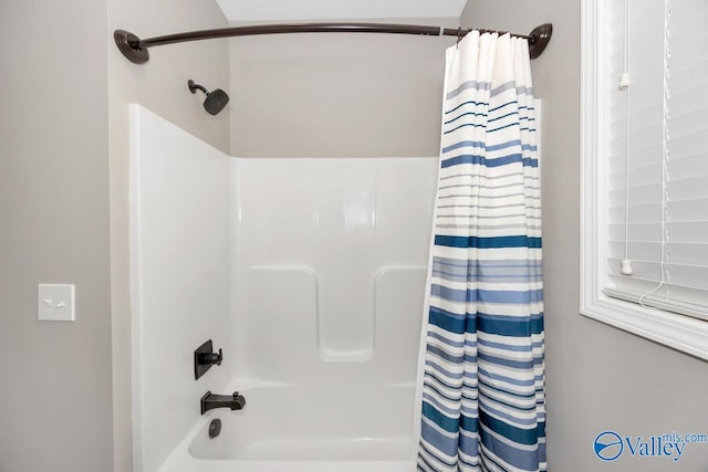 7528 Flint Crossing Cir, Owens Cross Roads, AL 35763 - bathroom featuring shower / bath combo with shower curtain
