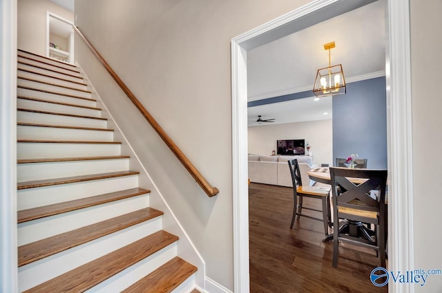 7528 Flint Crossing Cir, Owens Cross Roads, AL 35763 - stairs featuring wood finished floors, a ceiling fan, and a chandelier
