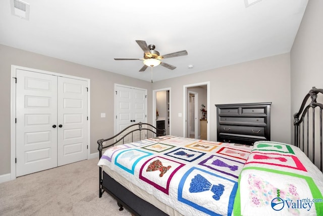 7528 Flint Crossing Cir, Owens Cross Roads, AL 35763 - bedroom with light colored carpet, a ceiling fan, and a closet