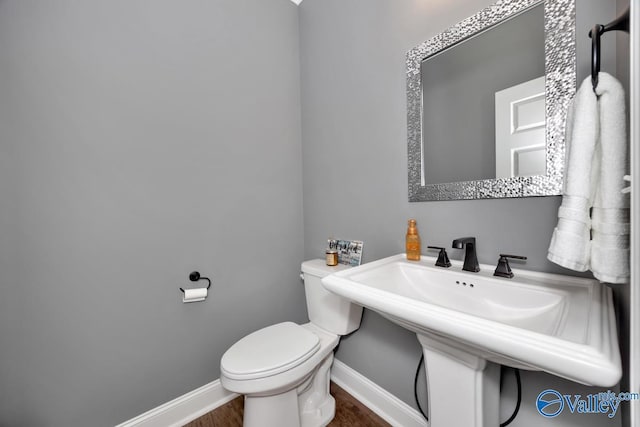 7528 Flint Crossing Cir, Owens Cross Roads, AL 35763 - half bathroom featuring baseboards and wood finished floors