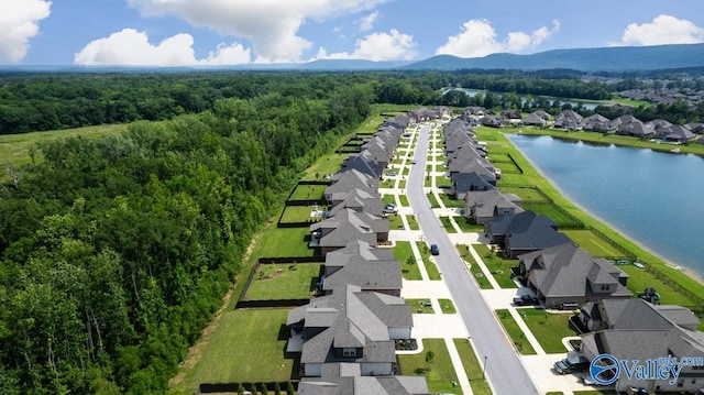 7528 Flint Crossing Cir, Owens Cross Roads, AL 35763 - aerial perspective of suburban area featuring a water and mountain view and a heavily wooded area