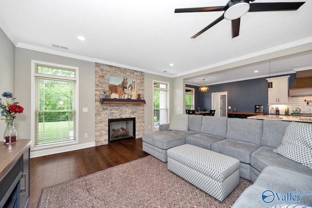 7528 Flint Crossing Cir, Owens Cross Roads, AL 35763 - living area with wood finished floors, ceiling fan, crown molding, recessed lighting, and a fireplace