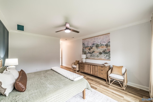 7326 Vidette Ln SE, Owens Cross Roads, AL 35763 - bedroom featuring crown molding, light wood-style flooring, and a ceiling fan