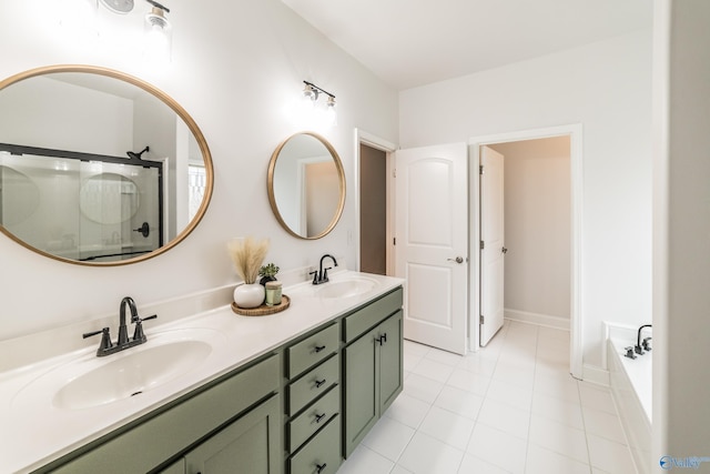 7326 Vidette Ln SE, Owens Cross Roads, AL 35763 - bathroom featuring double vanity, tile patterned flooring, a bath, and a shower with shower door