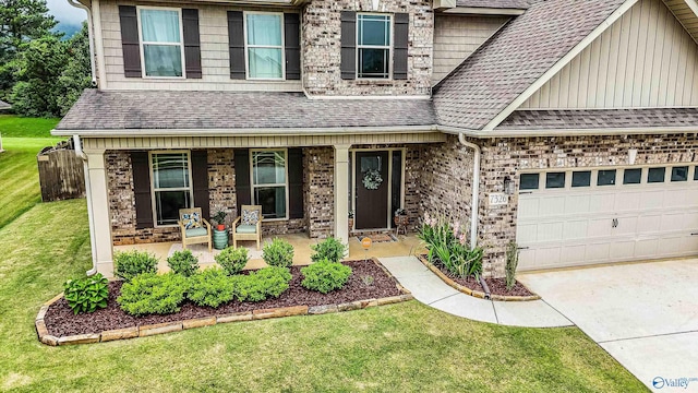 7326 Vidette Ln SE, Owens Cross Roads, AL 35763 - view of front facade with covered porch, a shingled roof, a garage, and driveway