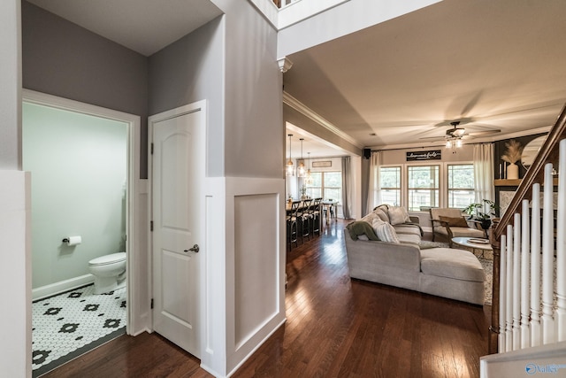 7326 Vidette Ln SE, Owens Cross Roads, AL 35763 - living area with dark wood finished floors, a chandelier, ceiling fan, and ornamental molding