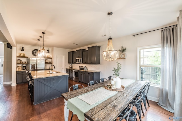 7326 Vidette Ln SE, Owens Cross Roads, AL 35763 - dining room featuring a chandelier and dark wood-style floors