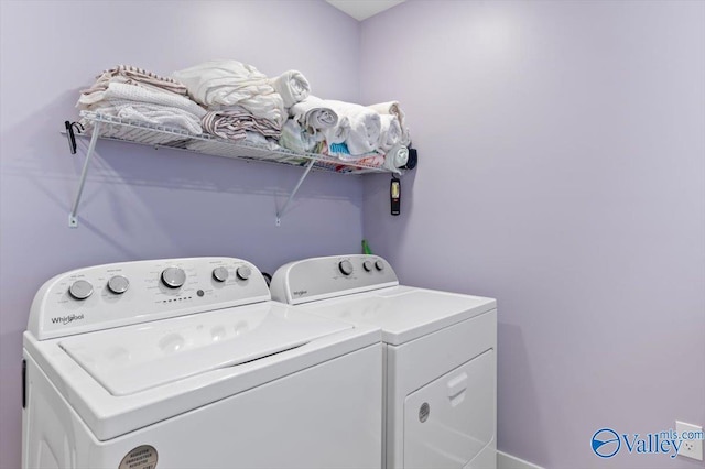 laundry room with washing machine and clothes dryer