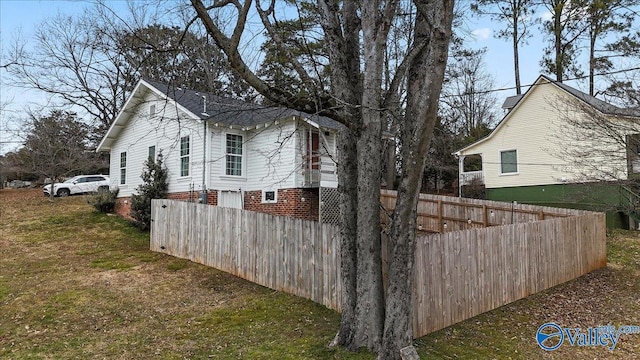 view of property exterior featuring a lawn