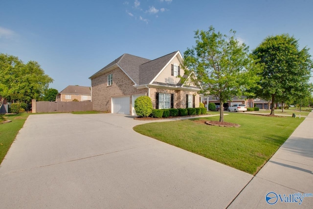 view of front of house with a garage and a front lawn