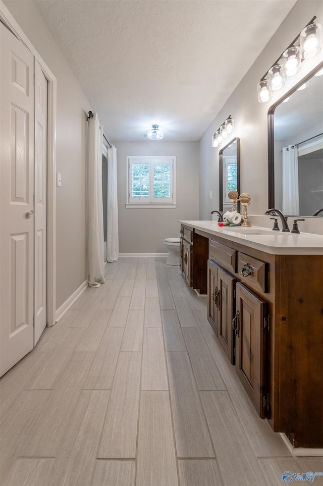 814 E Haven Dr, Glencoe, AL 35905 - full bath with vanity, wood finished floors, and curtained shower