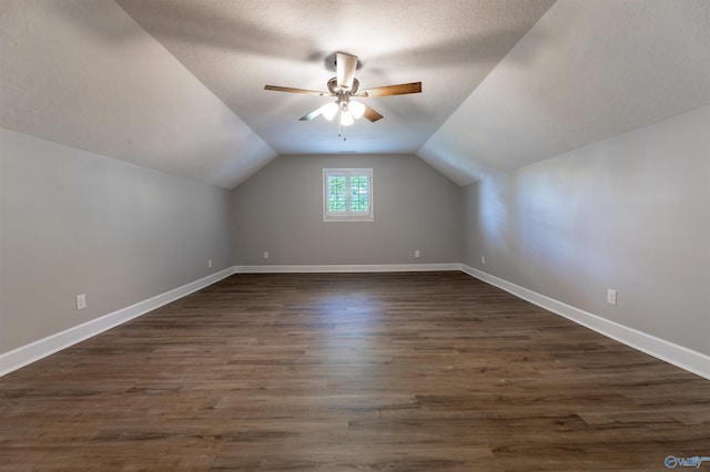814 E Haven Dr, Glencoe, AL 35905 - additional living space featuring lofted ceiling, a ceiling fan, dark wood finished floors, and a textured ceiling