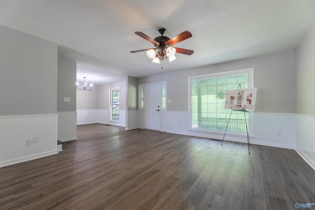814 E Haven Dr, Glencoe, AL 35905 - unfurnished living room featuring a chandelier, dark wood-style flooring, wainscoting, ceiling fan, and plenty of natural light