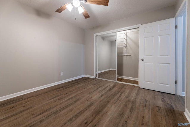 814 E Haven Dr, Glencoe, AL 35905 - unfurnished bedroom featuring dark wood finished floors, a closet, and ceiling fan