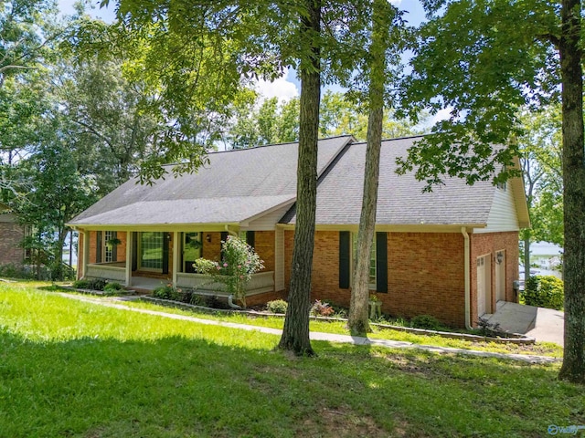 814 E Haven Dr, Glencoe, AL 35905 - view of front of property with brick siding, a shingled roof, an attached garage, a front yard, and concrete driveway