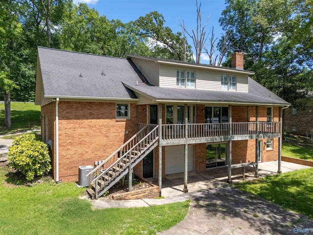 814 E Haven Dr, Glencoe, AL 35905 - view of front facade with brick siding, a garage, a chimney, and driveway