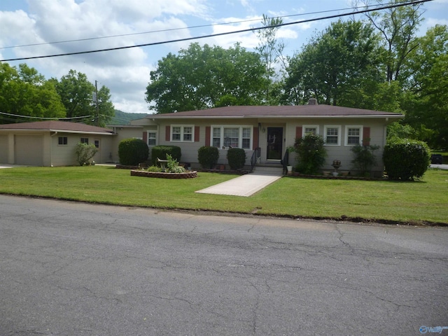 single story home with a front lawn